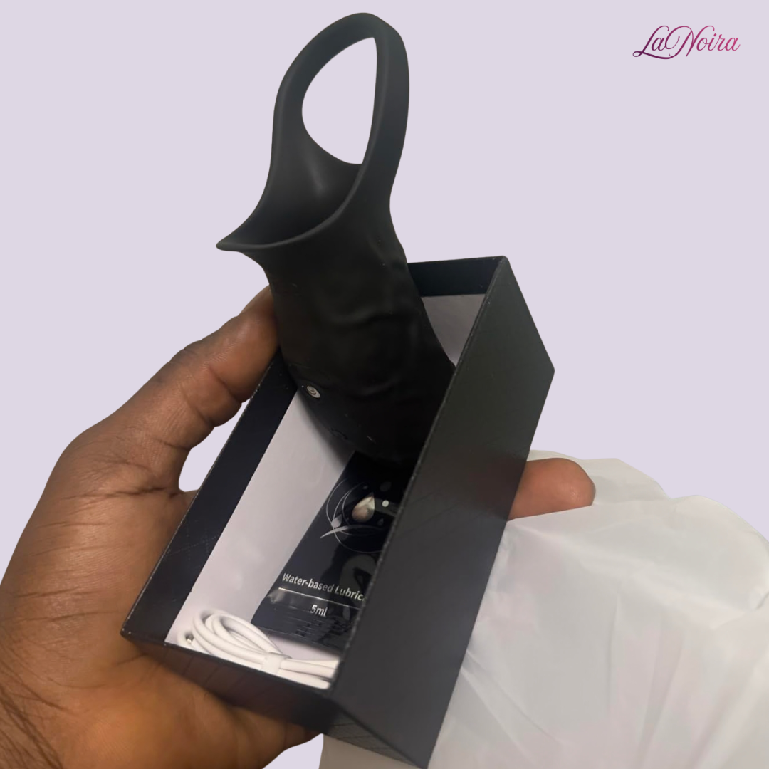 LaNoira ZephyrFlex 360 vibrating sleeve shown partially unpacked in box with USB charging cable and lubricant sachet