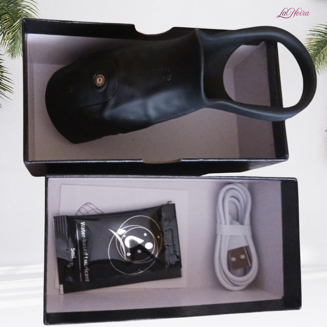 LaNoira ZephyrFlex 360 vibrating sleeve laid flat in open packaging with charging cable and lubricant sachet