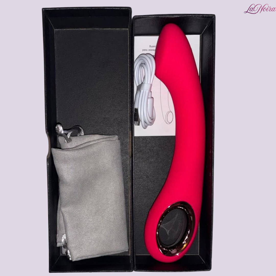 Open black box showing LaNoira Halo curved vibrator, USB charger, storage pouch, and instruction leaflet