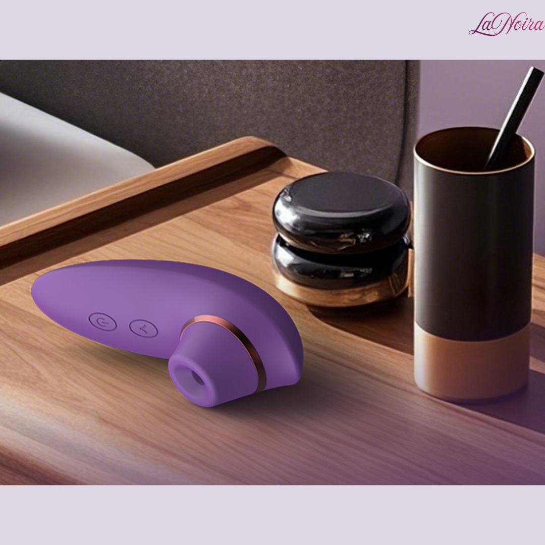 LaNoira Aria clitoral stimulator placed on bedside table highlighting discreet lifestyle use
