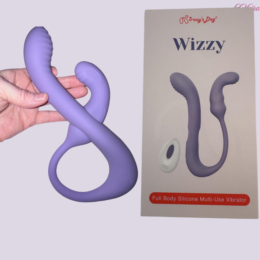 Tracy’s Dog Wizzy full body silicone multi-use vibrator shown beside original retail packaging