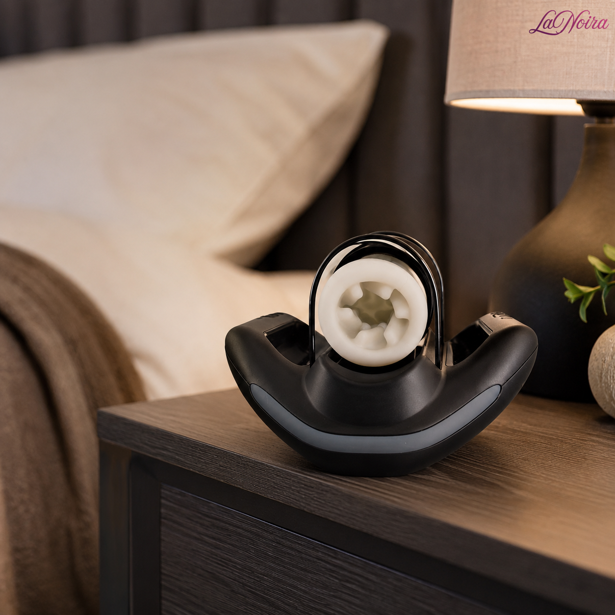 Kaotik Labs Jetpack automated thrusting stroker displayed on a bedside table with ambient lighting in a premium bedroom environment – LaNoira India