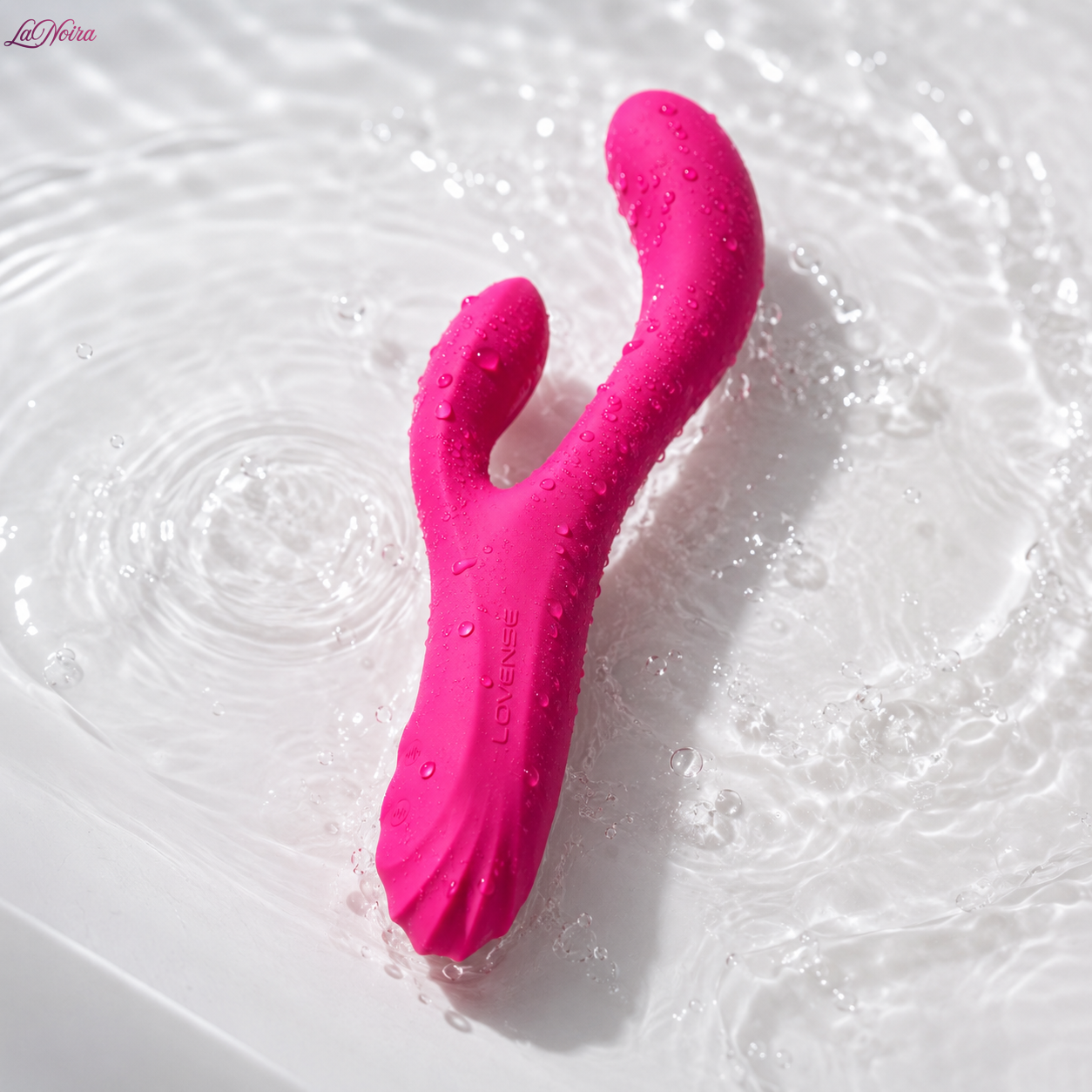 LOVENSE Osci 3 waterproof heating rabbit vibrator covered with water droplets and displayed in splashing water - LaNoira India.