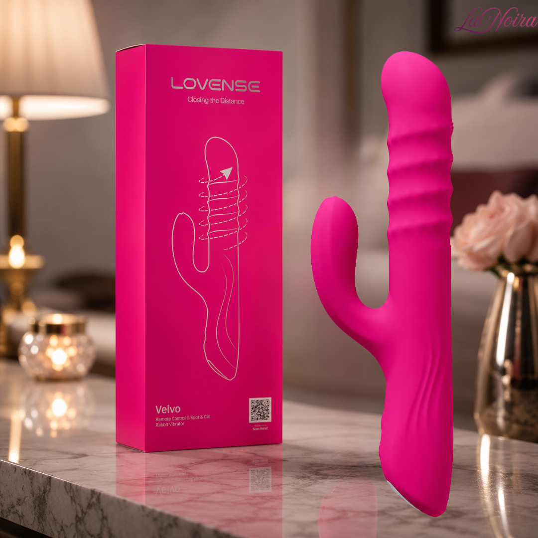 Lovense Velvo app-controlled rabbit vibrator standing beside retail packaging box showing the dual-stimulation design and remote-control functionality.