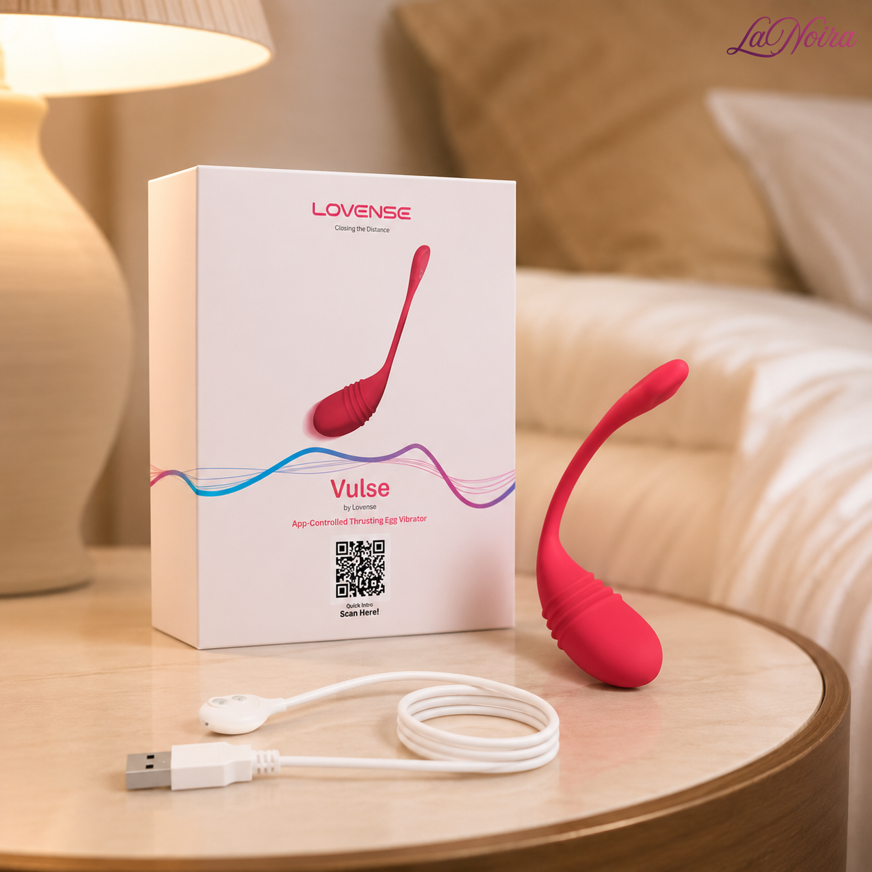 LOVENSE Vulse app-controlled thrusting egg vibrator displayed with retail packaging and magnetic USB charging cable in a bedroom setting - LaNoira India.